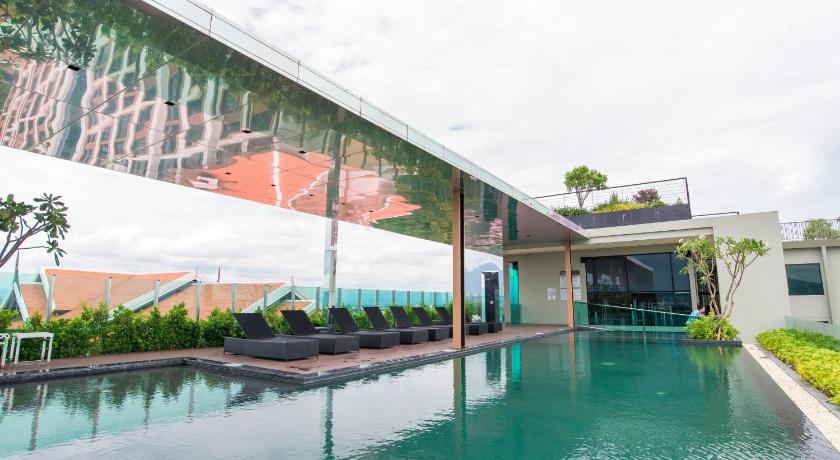 a large swimming pool in a tropical setting, The Astra A719 in Chiang Mai a large swimming pool in a tropical setting, The Astra A719 in Chiang Mai