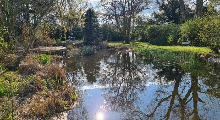 The Reading chalet with gardens and koi pond