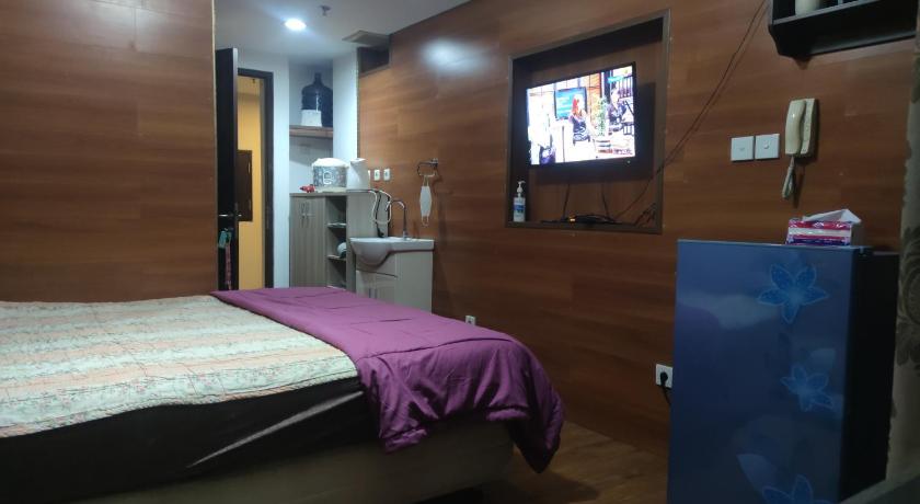 Grand Dhika Apartement by 2325 Studio room with cozy wooden style room