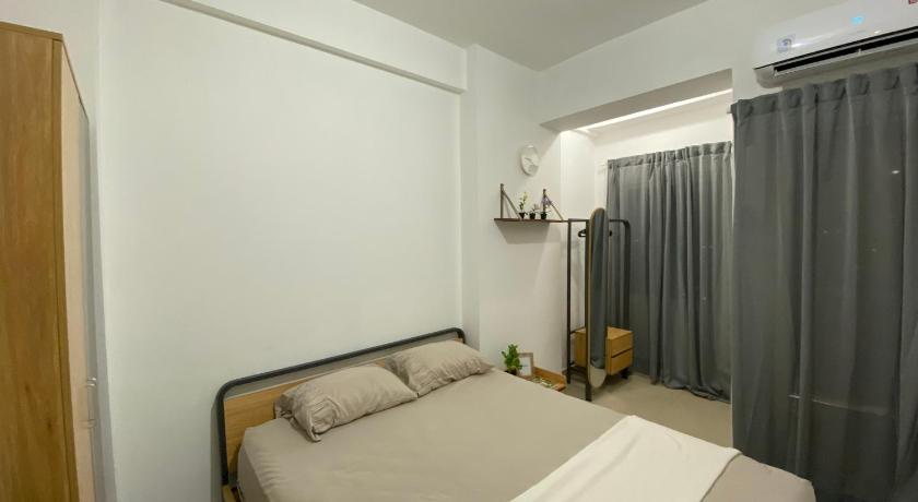 Minimalist room at The Nest Apartment by Popobella Near Puri Indah West Jakarta