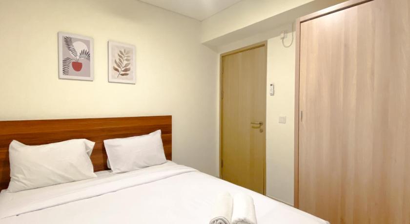 Spacious and Homey Apartment 2BR at Meikarta By Travelio
