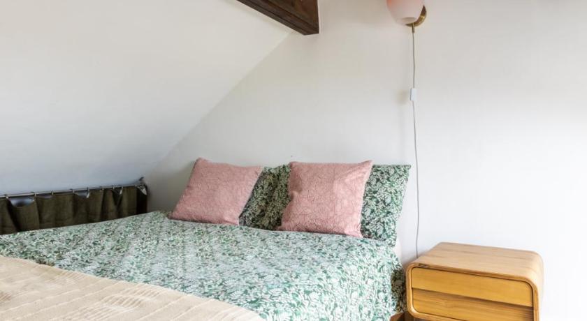 En-suite with double bed on mezzanine and desk in family home