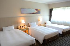 Phòng Tiêu chuẩn 2 Giường đơn có giường phụ. (Standard Twin Room with Extra Bed)