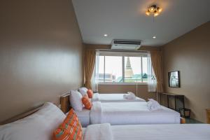 Family Room with Shared Bathroom room in Feung Nakorn Balcony Rooms and Cafe