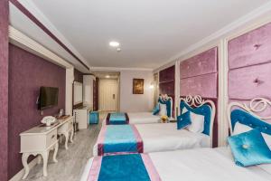 Deluxe Triple Room room in Marnas Hotels