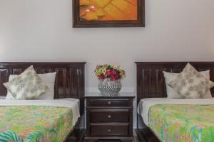 Suite Gia Đình Grand Với Tầm Nhìn Ra Hồ Bơi & Vườn (Grand Family Suite Garden & Pool View)