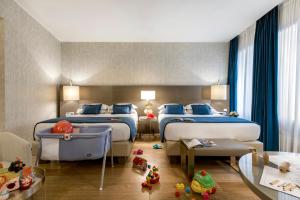 Family Quadruple room in Rosa Grand Milano - Starhotels Collezione
