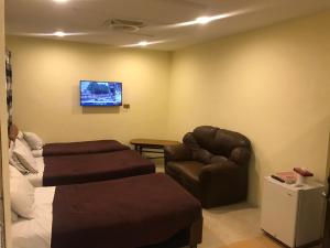 Deluxe Triple Room room in National City Hotel