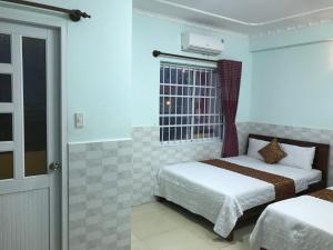 Phòng Deluxe Có 2 Giường Cỡ Queen (Deluxe Queen Room with Two Queen Beds)