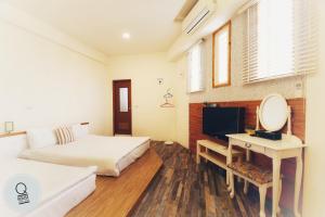 Phòng Hai Giường Đơn Bốn Người (Quadruple Twin Room)