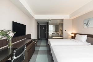 Phòng Hai Giường Đơn Loại Sang (Deluxe Twin Room)