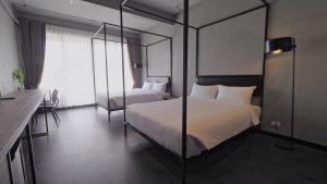 Phòng Hai Giường Đơn Loại Sang (Deluxe Twin Room)