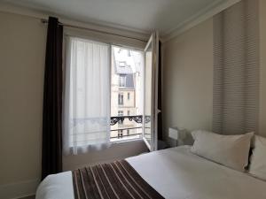 Standard Triple Room room in Hôtel Océanic - Grands Magasins