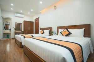 Phòng Deluxe Có 2 Giường Cỡ Queen (Deluxe Queen Room with Two Queen Beds)