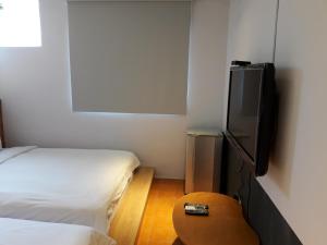 Phòng Bốn Người Có Phòng Tắm Riêng (Quadruple Room with Private Bathroom)