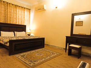 Deluxe Double Room (2 Adults + 1 Child) room in Delano Guest House