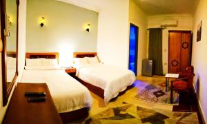 Deluxe Double Room (2 Adults + 1 Child) room in Pyramids Paradise Hotel
