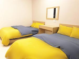 Phòng Hai Giường Đơn Loại Sang (Deluxe Twin Room)