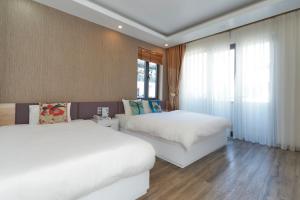 Phòng Hai Giường Đơn Loại Sang (Deluxe Twin Room)