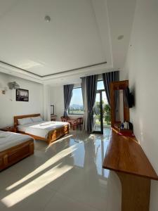 Phòng Deluxe Giường Đôi/2 Giường Đơn Có Ban Công (Deluxe Double or Twin Room with Balcony)