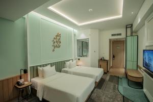 Phòng Hai Giường Đơn Loại Sang (Deluxe Twin Room)