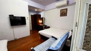 Phòng 4 người nhìn ra vườn (Quadruple Room with Garden View)
