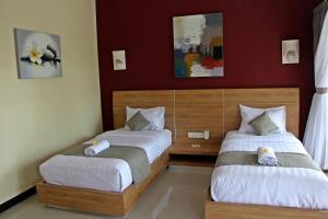 Phòng Deluxe có 2 Giường đơn kèm Quyền lui tới Hồ bơi (Deluxe Twin Room with Pool Access)