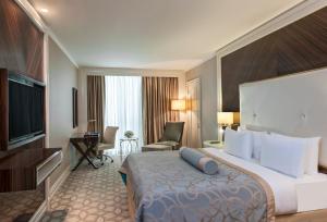 Corner Room with Queen Size Bed room in Elite World Business Hotel
