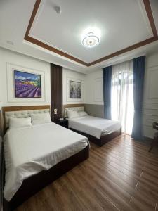 Phòng Deluxe Giường Đôi/2 Giường Đơn Có Ban Công (Deluxe Double or Twin Room with Balcony)