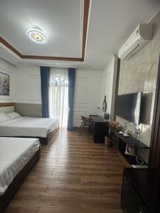 Phòng Deluxe Giường Đôi/2 Giường Đơn Có Ban Công (Deluxe Double or Twin Room with Balcony)