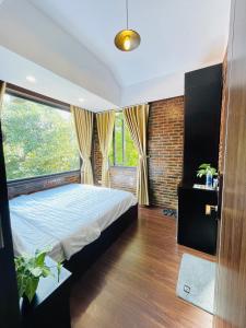 Phòng Giường Đôi Lớn Hướng Vườn (Queen Room with Garden View)