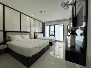 Phòng Deluxe Có 2 Giường Cỡ Queen (Deluxe Queen Room with Two Queen Beds)
