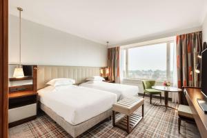 Twin Deluxe Room with Canal View room in Hilton Amsterdam