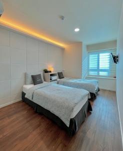 Phòng Hai Giường Đơn Loại Sang (Deluxe Twin Room)
