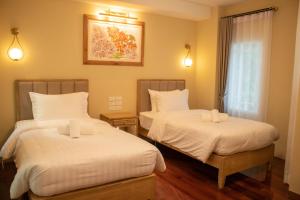 Phòng Hai Giường Đơn Loại Sang (Deluxe Twin Room)