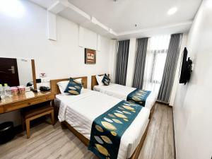 Phòng Hai Giường Đơn Loại Sang (Deluxe Twin Room)