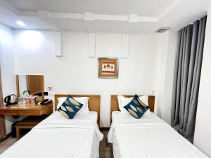 Phòng Hai Giường Đơn Loại Sang (Deluxe Twin Room)