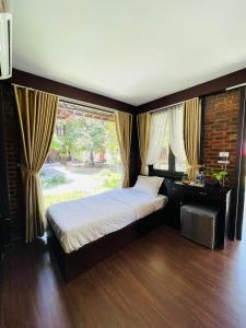Phòng Tiêu Chuẩn 2 Giường Đơn Nhìn Ra Khu Vườn (Standard Twin Room with Garden View)