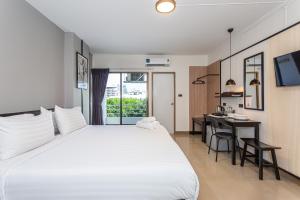 Deluxe King Room with Balcony room in CK2 Hotel SHA EXTRA PLUS