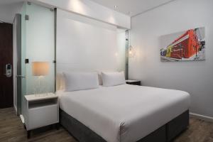 Larger Guest room with Balcony room in Protea Hotel by Marriott Fire & Ice Cape Town