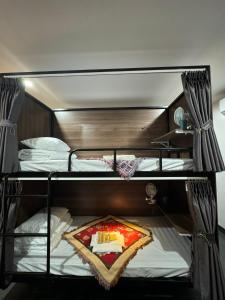 Giường trong phòng ngủ tập thể dành cho nam (Bed in Male Dormitory Room)