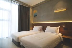 Phòng Hai Giường Đơn Loại Sang (Deluxe Twin Room)