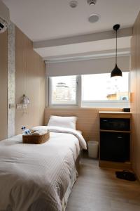 Phòng giường đơn có phòng tắm chung (Single Room with Shared Bathroom)