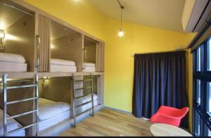 Giường trong phòng ngủ tập thể dành cho nam (Bed in Male Dormitory Room)