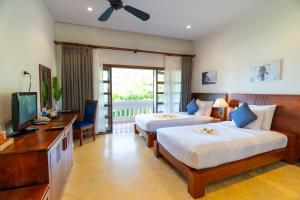 Phòng Premier Giường Đôi/2 Giường Đơn Có Ban Công Và Tầm Nhìn Ra Vườn (Premier Double or Twin Room with Balcony and Garden View)