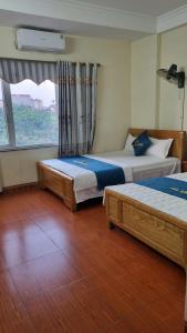 Phòng Deluxe Có 2 Giường Cỡ Queen (Deluxe Queen Room with Two Queen Beds)