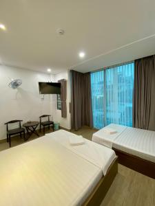 Phòng Bốn Người Có Phòng Tắm Riêng (Quadruple Room with Private Bathroom)