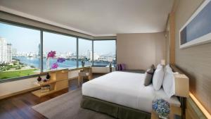 Avani River View Junior Suite room in Avani Riverside Bangkok Hotel
