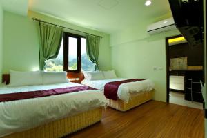 Phòng 4 người có phòng tắm riêng (Quadruple Room with Private Bathroom)