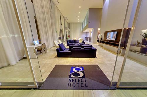 Shared lounge/TV area, Select Hotel in Palmas Shared lounge/TV area, Select Hotel in Palmas